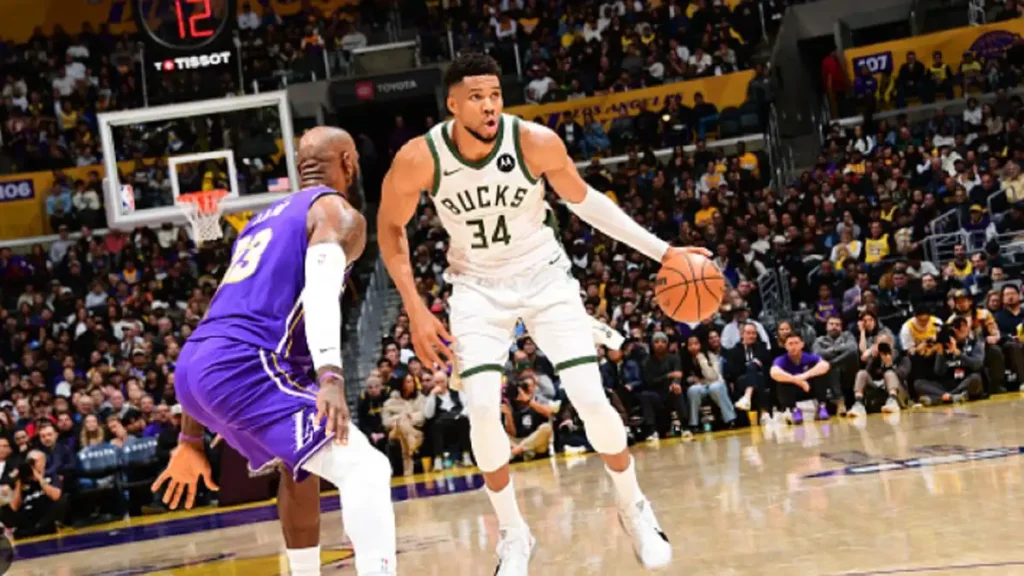 Giannis Antetokounmpo denies LeBron James during the Bucks vs Lakers game.